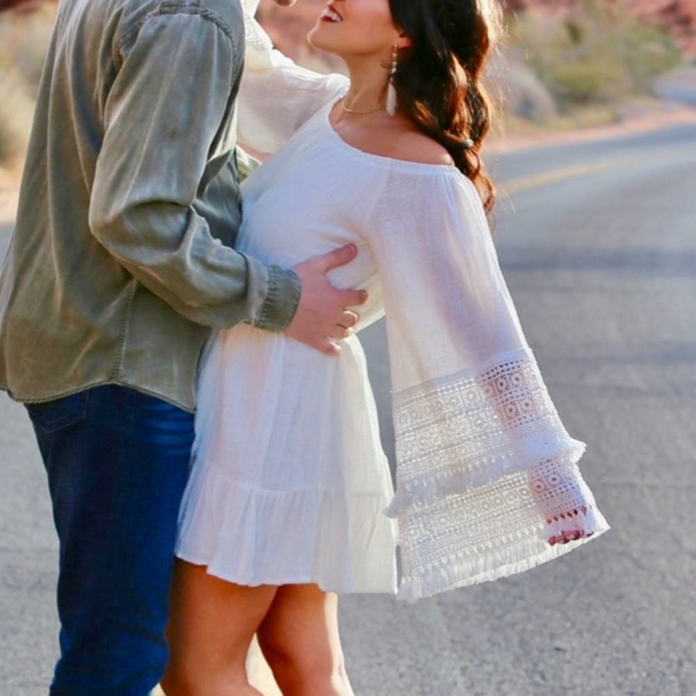 WORN ONCE. Size Large. White off the shoulder dress. Detailed bell sleeves.